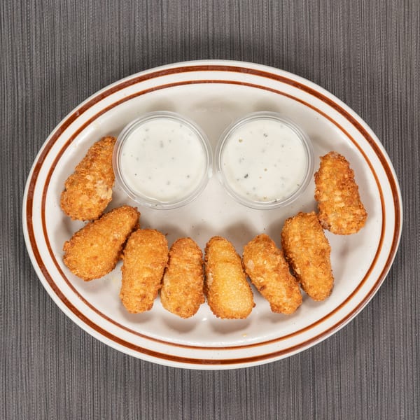 Golden-brown fried chicken tenders arranged in a semicircle with two cups of dipping sauce on a white plate.